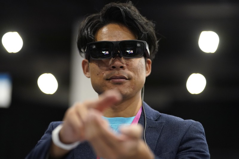 The Anura Lite is demonstrated at the Nuralogix booth during CES Unveiled ahead of the CES tech show, Tuesday, Jan. 3, 2023, in Las Vegas. The application uses a 30-second video selfie to capture facial blood flow patterns, which are used to output medical-grade health and vital sign measurements. (AP Photo/Rick Bowmer)