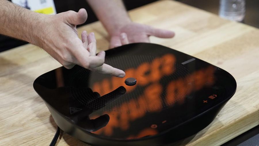The Anura Lite is demonstrated at the Nuralogix booth during CES Unveiled ahead of the CES tech show, Tuesday, Jan. 3, 2023, in Las Vegas. The application uses a 30-second video selfie to capture facial blood flow patterns, which are used to output medical-grade health and vital sign measurements. (AP Photo/Rick Bowmer)