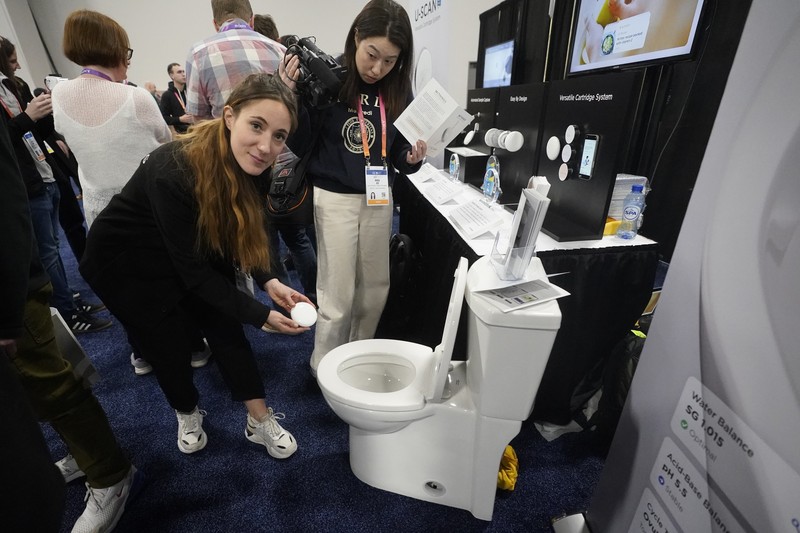 The Anura Lite is demonstrated at the Nuralogix booth during CES Unveiled ahead of the CES tech show, Tuesday, Jan. 3, 2023, in Las Vegas. The application uses a 30-second video selfie to capture facial blood flow patterns, which are used to output medical-grade health and vital sign measurements. (AP Photo/Rick Bowmer)
