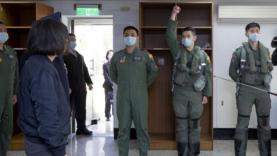 In this photo released by the Taiwan Presidential Office, soldiers take part in a drill during a visit by Taiwan's President Tsai Ing-wen, at a military base in Chiayi in southwestern Taiwan, Friday, Jan. 6, 2023. President Tsai visited a military base Friday to observe drills while rival China protested the passage of a U.S. Navy destroyer through the Taiwan Strait, as tensions between the sides showed no sign of abating in the new year. (Taiwan Presidential Office via AP)