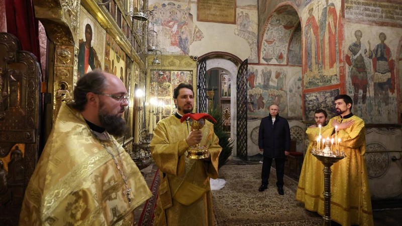 Russian President Vladimir Putin, background center, attends the Christmas service at the Annunciation Cathedral in the Moscow Kremlin in Moscow, Russia, Saturday, Jan. 7, 2023. Orthodox Christians celebrate Christmas on Jan. 7, in accordance with the Julian calendar. (Mikhail Klimentyev, Sputnik, Kremlin Pool Photo via AP)