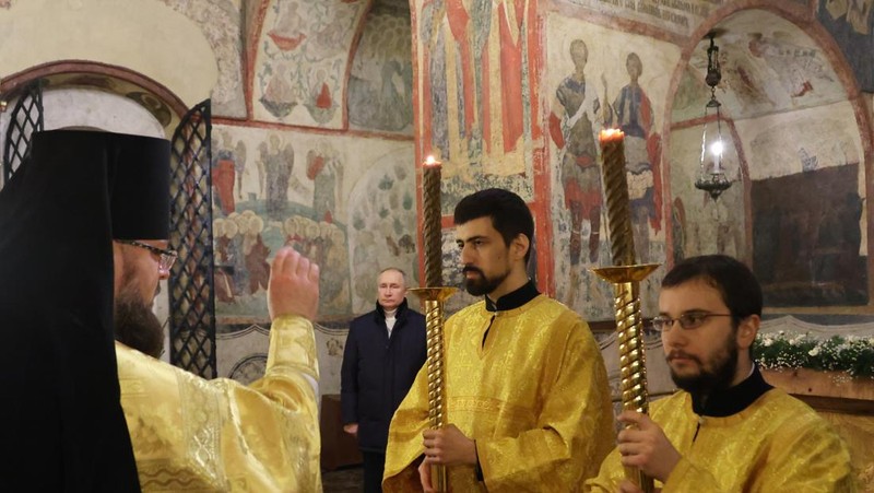 Russian President Vladimir Putin, background center, attends the Christmas service at the Annunciation Cathedral in the Moscow Kremlin in Moscow, Russia, Saturday, Jan. 7, 2023. Orthodox Christians celebrate Christmas on Jan. 7, in accordance with the Julian calendar. (Mikhail Klimentyev, Sputnik, Kremlin Pool Photo via AP)