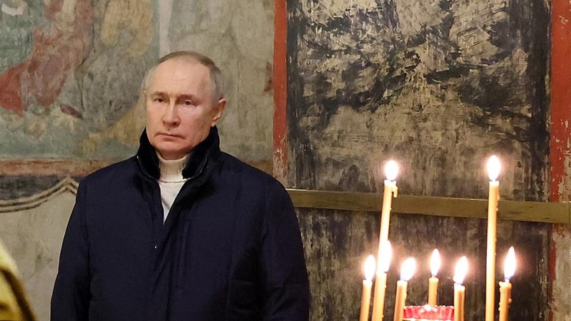 Russian President Vladimir Putin, background center, attends the Christmas service at the Annunciation Cathedral in the Moscow Kremlin in Moscow, Russia, Saturday, Jan. 7, 2023. Orthodox Christians celebrate Christmas on Jan. 7, in accordance with the Julian calendar. (Mikhail Klimentyev, Sputnik, Kremlin Pool Photo via AP)