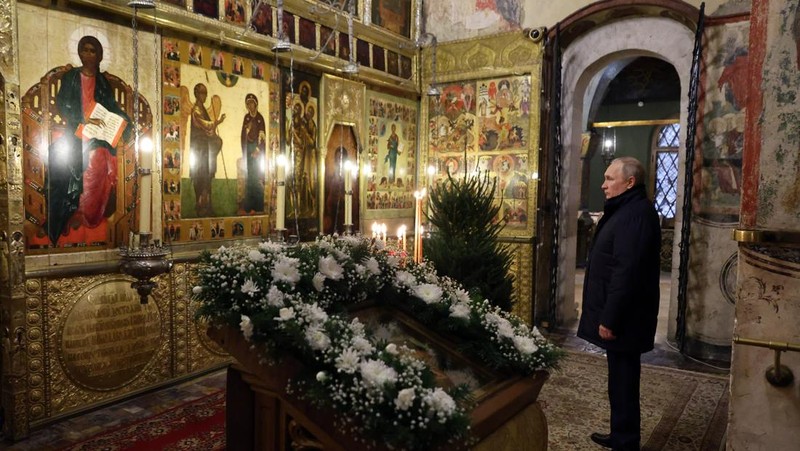 Russian President Vladimir Putin, background center, attends the Christmas service at the Annunciation Cathedral in the Moscow Kremlin in Moscow, Russia, Saturday, Jan. 7, 2023. Orthodox Christians celebrate Christmas on Jan. 7, in accordance with the Julian calendar. (Mikhail Klimentyev, Sputnik, Kremlin Pool Photo via AP)