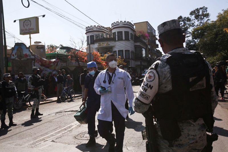 Rescue personnel work near the area where two subway trains collide head-on at a subway station, in Mexico City, Mexico, January 7, 2023. REUTERS/Quetzalli Nicte-Ha