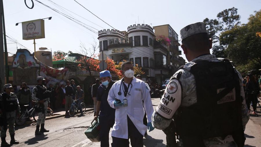 Rescue personnel work near the area where two subway trains collide head-on at a subway station, in Mexico City, Mexico, January 7, 2023. REUTERS/Quetzalli Nicte-Ha