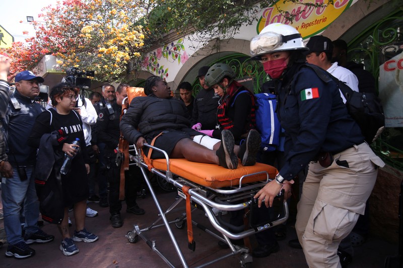 Rescue personnel work near the area where two subway trains collide head-on at a subway station, in Mexico City, Mexico, January 7, 2023. REUTERS/Quetzalli Nicte-Ha