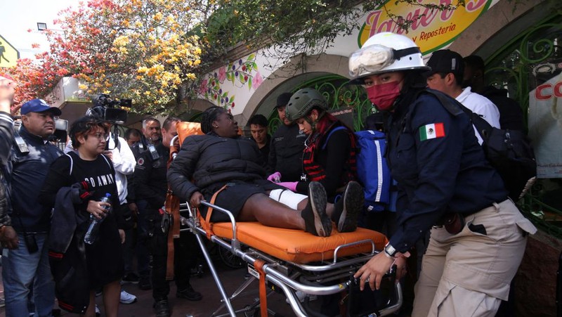 Rescue personnel work near the area where two subway trains collide head-on at a subway station, in Mexico City, Mexico, January 7, 2023. REUTERS/Quetzalli Nicte-Ha