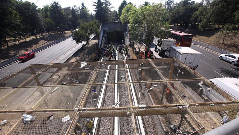 Rescue personnel work near the area where two subway trains collide head-on at a subway station, in Mexico City, Mexico, January 7, 2023. REUTERS/Quetzalli Nicte-Ha