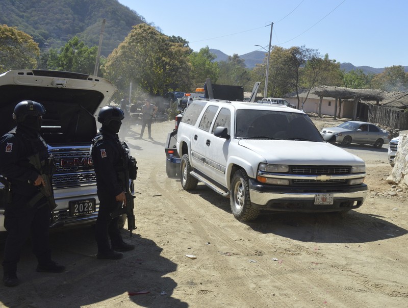 Mexico Violence A vehicle riddled with bullets lies overturned on a street in Jesus Maria, Mexico, on Saturday, Jan. 7, 2023, the small town where Ovidio Guzman was detained earlier in the week. Thursday's government operation to detain Ovidio, the son of imprisoned drug lord Joaquin