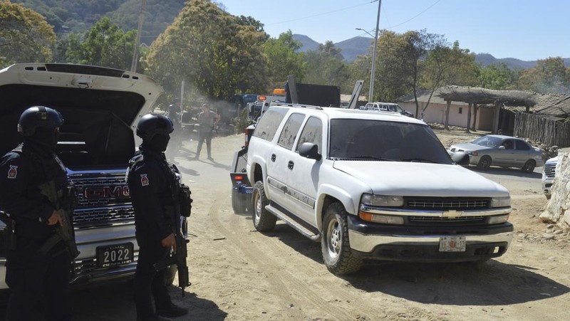 A vehicle riddled with bullets lies overturned on a street in Jesus Maria, Mexico, on Saturday, Jan. 7, 2023, the small town where Ovidio Guzman was detained earlier in the week. Thursday's government operation to detain Ovidio, the son of imprisoned drug lord Joaquin 