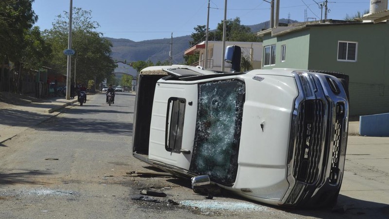 A vehicle riddled with bullets lies overturned on a street in Jesus Maria, Mexico, on Saturday, Jan. 7, 2023, the small town where Ovidio Guzman was detained earlier in the week. Thursday's government operation to detain Ovidio, the son of imprisoned drug lord Joaquin 