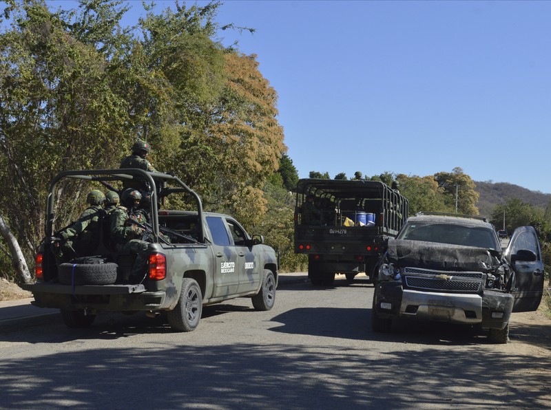 Mexico Violence A vehicle riddled with bullets lies overturned on a street in Jesus Maria, Mexico, on Saturday, Jan. 7, 2023, the small town where Ovidio Guzman was detained earlier in the week. Thursday's government operation to detain Ovidio, the son of imprisoned drug lord Joaquin