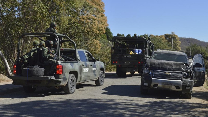 A vehicle riddled with bullets lies overturned on a street in Jesus Maria, Mexico, on Saturday, Jan. 7, 2023, the small town where Ovidio Guzman was detained earlier in the week. Thursday's government operation to detain Ovidio, the son of imprisoned drug lord Joaquin 