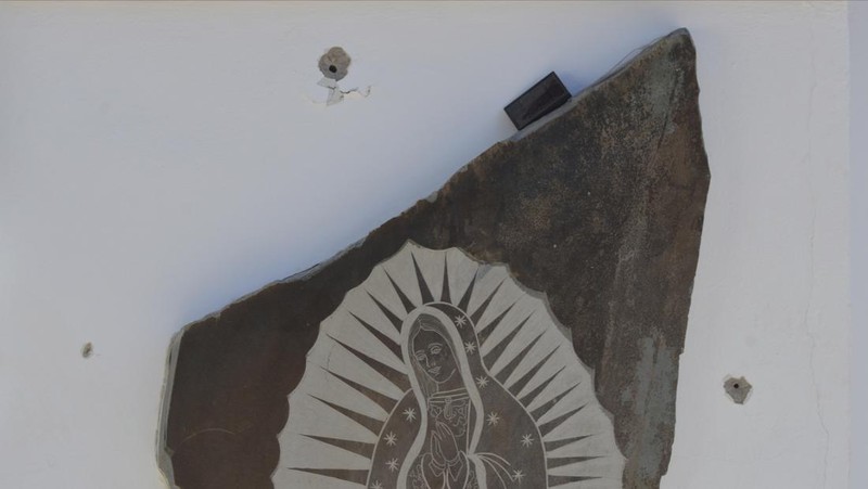 A vehicle riddled with bullets lies overturned on a street in Jesus Maria, Mexico, on Saturday, Jan. 7, 2023, the small town where Ovidio Guzman was detained earlier in the week. Thursday's government operation to detain Ovidio, the son of imprisoned drug lord Joaquin 