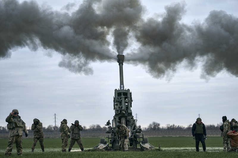 APTOPIX Russia Ukraine War Ukrainian military medics carry a body of their killed comrade into a morgue in Donetsk region, Ukraine, Monday, Jan. 9, 2023. (AP Photo/Evgeniy Maloletka)