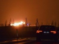 Kobaran api terlihat di pipa gas di wilayah Pasvalys di Lithuania utara, dekat perbatasan Latvia. (AP/Paulius Zidonis)