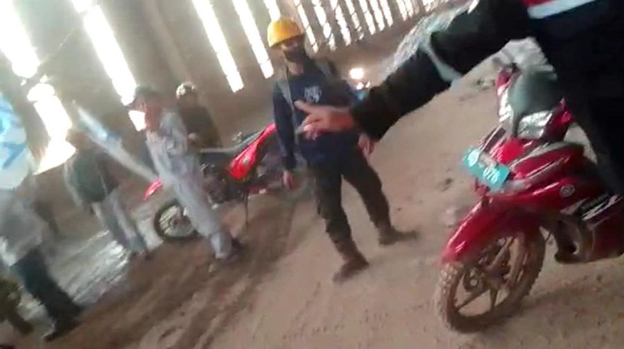 Employees react amid the chaos as Chinese and Indonesian workers clash at a nickel smelter in Morowali, Sulawesi, Indonesia in this undated social media video released January 16, 2023. Revi Limbong via REUTERS THIS IMAGE HAS BEEN SUPPLIED BY A THIRD PARTY. MANDATORY CREDIT