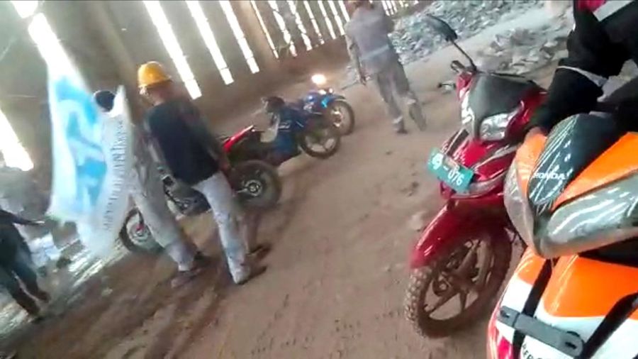 Employees react amid the chaos as Chinese and Indonesian workers clash at a nickel smelter in Morowali, Sulawesi, Indonesia in this undated social media video released January 16, 2023. Revi Limbong via REUTERS THIS IMAGE HAS BEEN SUPPLIED BY A THIRD PARTY. MANDATORY CREDIT