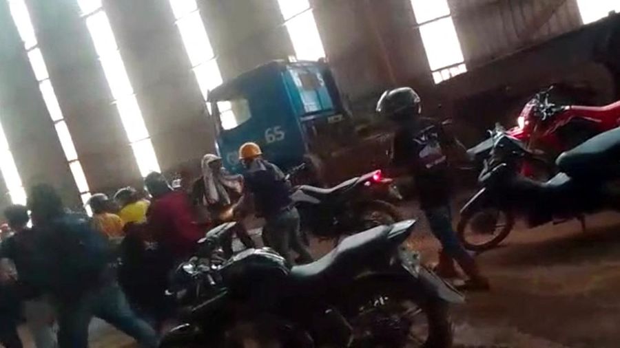 Employees react amid the chaos as Chinese and Indonesian workers clash at a nickel smelter in Morowali, Sulawesi, Indonesia in this undated social media video released January 16, 2023. Revi Limbong via REUTERS THIS IMAGE HAS BEEN SUPPLIED BY A THIRD PARTY. MANDATORY CREDIT