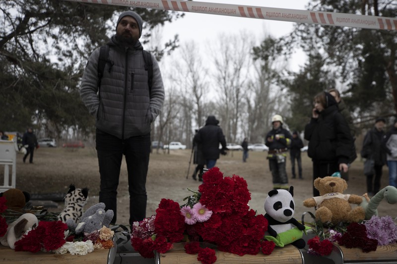 1456795838 DNIPRO, UKRAINE - JANUARY 15: Rescuers search people trapped under the rubble of a high-rise residential building hit by a missile on January 15, 2023 in Dnipro, Ukraine. On January 14, Russia launched a new massive attack on Ukrainian cities. In Dnipro, one of the Х-22 cruise missiles hit a nine-story residential building, completely destroying one of the sections from top to bottom floors. The number of dead has increased to 29 people, with rescue work continuing. More than 40 residents of the building are still being searched. (Photo by Yurii Stefanyak/Global Images Ukraine via Getty Images)