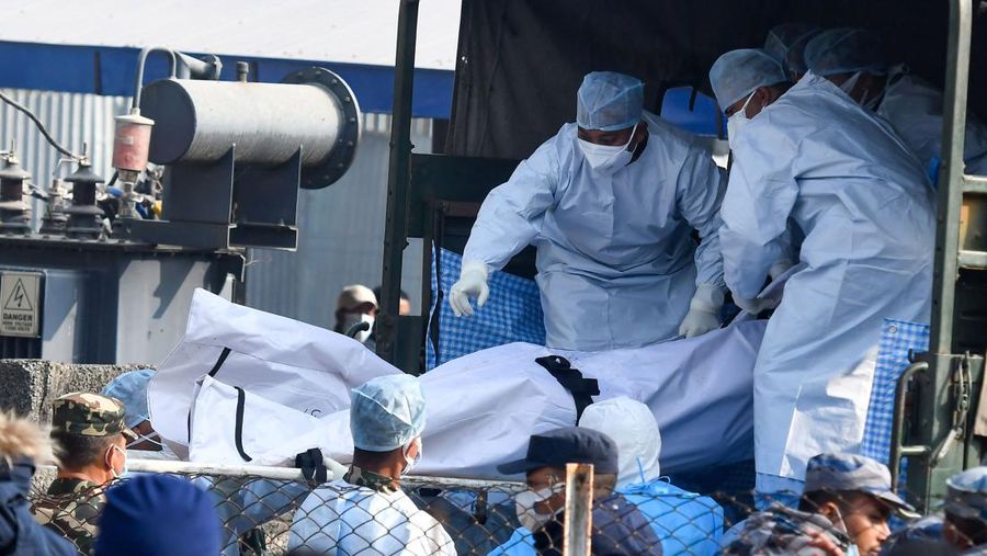 A rescue team recovers the bodies of victims from the site of the plane crash of a Yeti Airlines-operated aircraft, in Pokhara, Nepal January 16, 2023. REUTERS/Sulav Shrestha NO RESALES. NO ARCHIVES  REFILE - CORRECTING THE NUMBER OF BODIES    TPX IMAGES OF THE DAY