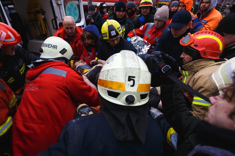 1456795838 DNIPRO, UKRAINE - JANUARY 15: Rescuers search people trapped under the rubble of a high-rise residential building hit by a missile on January 15, 2023 in Dnipro, Ukraine. On January 14, Russia launched a new massive attack on Ukrainian cities. In Dnipro, one of the Х-22 cruise missiles hit a nine-story residential building, completely destroying one of the sections from top to bottom floors. The number of dead has increased to 29 people, with rescue work continuing. More than 40 residents of the building are still being searched. (Photo by Yurii Stefanyak/Global Images Ukraine via Getty Images)