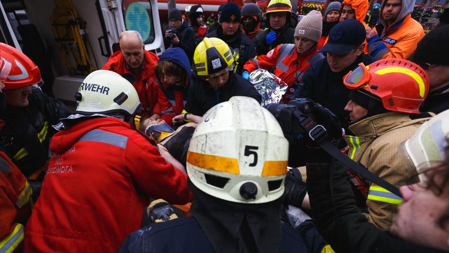 DNIPRO, UKRAINE - JANUARY 15: Rescuers search people trapped under the rubble of a high-rise residential building hit by a missile on January 15, 2023 in Dnipro, Ukraine. On January 14, Russia launched a new massive attack on Ukrainian cities. In Dnipro, one of the Х-22 cruise missiles hit a nine-story residential building, completely destroying one of the sections from top to bottom floors. The number of dead has increased to 29 people, with rescue work continuing. More than 40 residents of the building are still being searched. (Photo by Yurii Stefanyak/Global Images Ukraine via Getty Images)