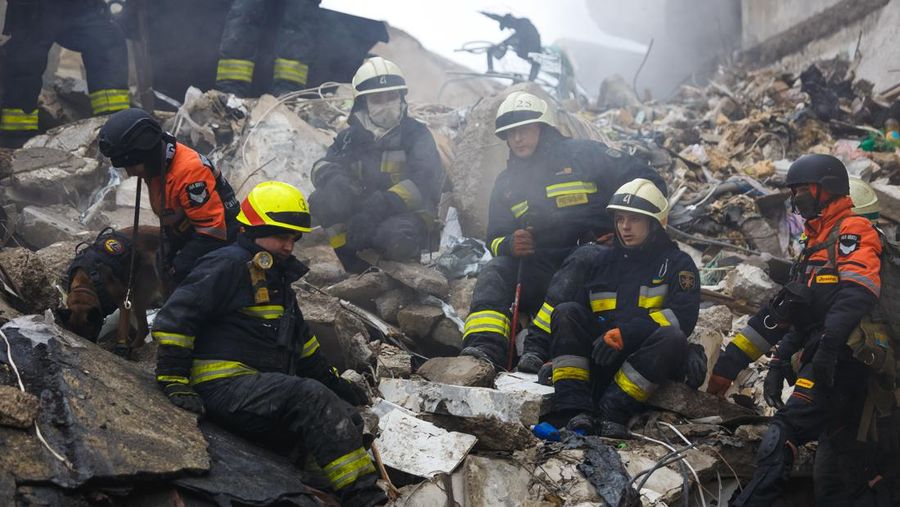 DNIPRO, UKRAINE - JANUARY 15: Rescuers search people trapped under the rubble of a high-rise residential building hit by a missile on January 15, 2023 in Dnipro, Ukraine. On January 14, Russia launched a new massive attack on Ukrainian cities. In Dnipro, one of the Х-22 cruise missiles hit a nine-story residential building, completely destroying one of the sections from top to bottom floors. The number of dead has increased to 29 people, with rescue work continuing. More than 40 residents of the building are still being searched. (Photo by Yurii Stefanyak/Global Images Ukraine via Getty Images)