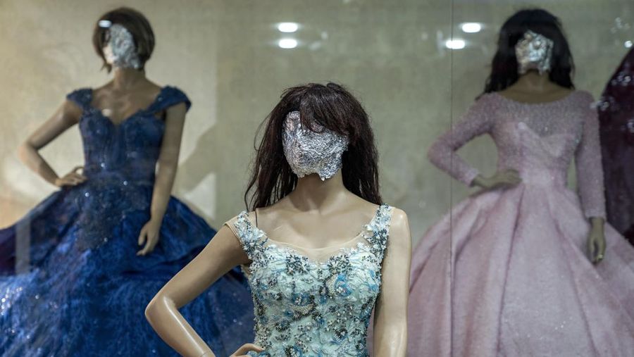 A mannequin's head is covered in a woman dress shop in Kabul, Afghanistan, Monday, Dec. 26, 2022. Under the Taliban, the mannequins in women's dress shops across the Afghan capital Kabul are a haunting sight, their heads cloaked in cloth sacks or wrapped in black plastic bags. The hooded mannequins are one symbol of the Taliban's puritanical rule over Afghanistan (AP Photo/Ebrahim Noroozi)