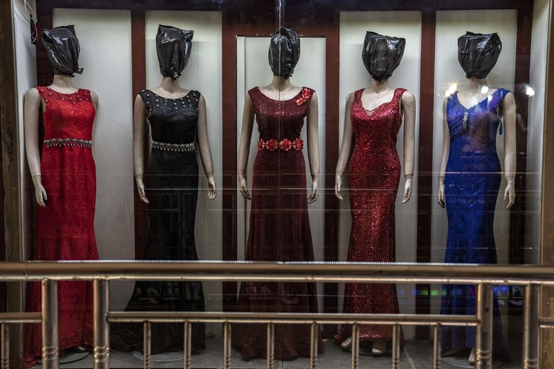 Afghanistan Mannequins Photo Gallery A mannequin's head is covered in a woman dress shop in Kabul, Afghanistan, Monday, Dec. 26, 2022. Under the Taliban, the mannequins in women's dress shops across the Afghan capital Kabul are a haunting sight, their heads cloaked in cloth sacks or wrapped in black plastic bags. The hooded mannequins are one symbol of the Taliban's puritanical rule over Afghanistan (AP Photo/Ebrahim Noroozi)