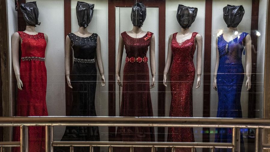 A mannequin's head is covered in a woman dress shop in Kabul, Afghanistan, Monday, Dec. 26, 2022. Under the Taliban, the mannequins in women's dress shops across the Afghan capital Kabul are a haunting sight, their heads cloaked in cloth sacks or wrapped in black plastic bags. The hooded mannequins are one symbol of the Taliban's puritanical rule over Afghanistan (AP Photo/Ebrahim Noroozi)