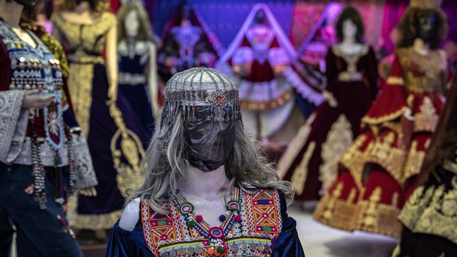 A mannequin's head is covered in a woman dress shop in Kabul, Afghanistan, Monday, Dec. 26, 2022. Under the Taliban, the mannequins in women's dress shops across the Afghan capital Kabul are a haunting sight, their heads cloaked in cloth sacks or wrapped in black plastic bags. The hooded mannequins are one symbol of the Taliban's puritanical rule over Afghanistan (AP Photo/Ebrahim Noroozi)