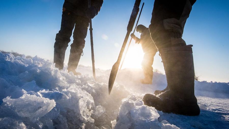 Villagers harvest ice from a local lake near the settlement of Oy, some 70 km south of Yakutsk, with the air temperature at about minus 41 degrees Celsius, on November 27, 2018. - Many people in the Sakha (Yakutia) Republic depend on melted water as there is no other way to supply water due to extremely cold winter temperatures in the permafrost-covered region. (Photo by Mladen ANTONOV / AFP) (Photo credit should read MLADEN ANTONOV/AFP via Getty Images)