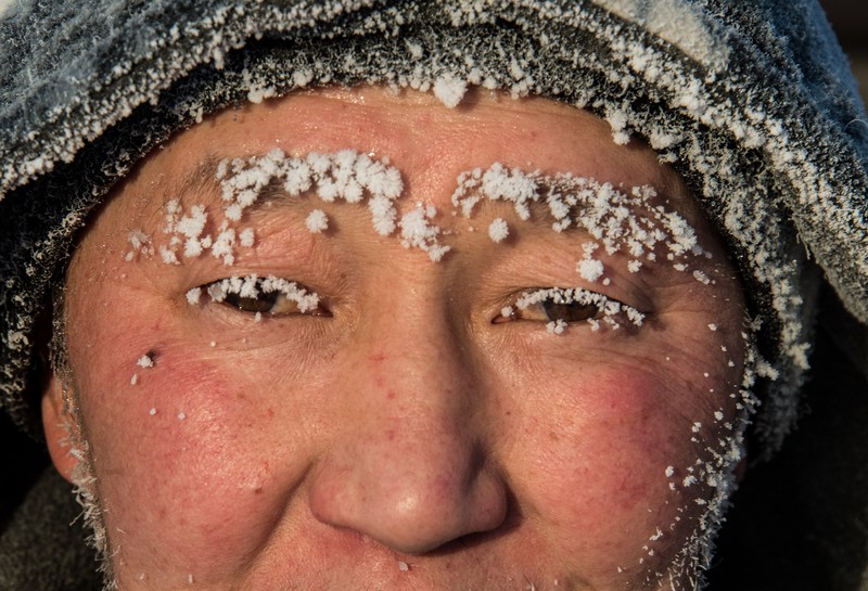 RUSSIA-WEATHER/YAKUTIA A car drives along a road on a frosty day in Yakutsk, Russia, January 15, 2023. Yakutsk, one of the Russia's north-most cities, is hit by an extreme cold snap as the air temperature on Sunday (January 15) plunged as low as minus 51 degrees Celsius (minus 59.8 degrees Fahrenheit). REUTERS/Roman Kutukov