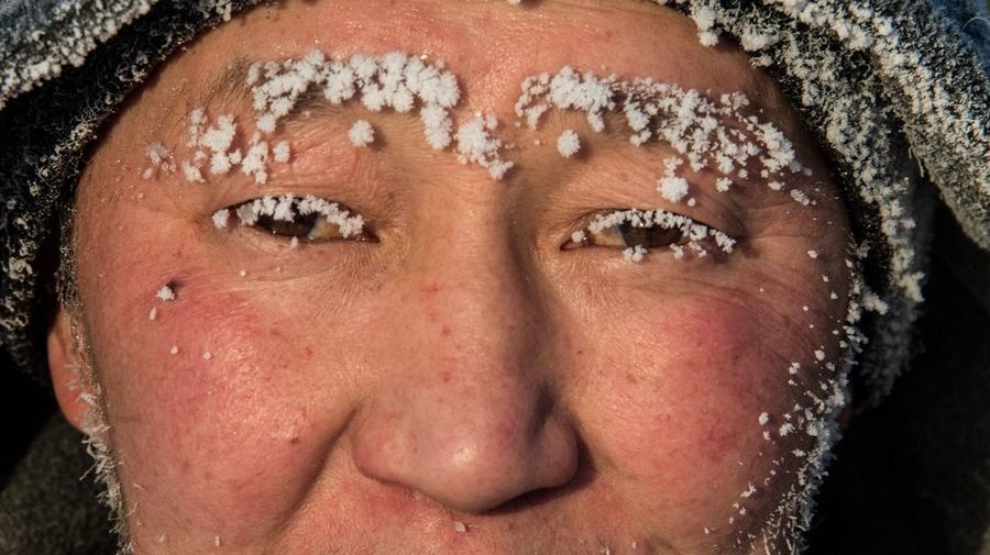 A car drives along a road on a frosty day in Yakutsk, Russia, January 15, 2023. Yakutsk, one of the Russia's north-most cities, is hit by an extreme cold snap as the air temperature on Sunday (January 15) plunged as low as minus 51 degrees Celsius (minus 59.8 degrees Fahrenheit). REUTERS/Roman Kutukov