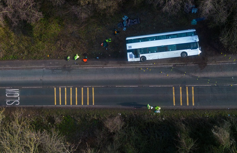 CANNINGTON, SOMERSET - JANUARY 17: An aerial view of police at the scene after the early-morning crash on January 17, 2023 near Cannington, Somerset, England. The bus was carrying workers at Hinkley Point C, the nuclear power station about 8 miles from the scene of the crash. (Photo by Finnbarr Webster/Getty Images)