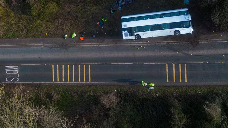CANNINGTON, SOMERSET - JANUARY 17: An aerial view of police at the scene after the early-morning crash on January 17, 2023 near Cannington, Somerset, England. The bus was carrying workers at Hinkley Point C, the nuclear power station about 8 miles from the scene of the crash. (Photo by Finnbarr Webster/Getty Images)