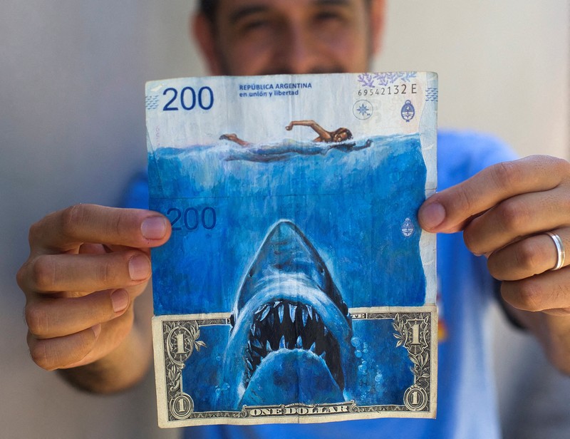 ARGENTINA-ART/INFLATION Artist Sergio Diaz intervenes Argentine pesos bills with characters of the movie