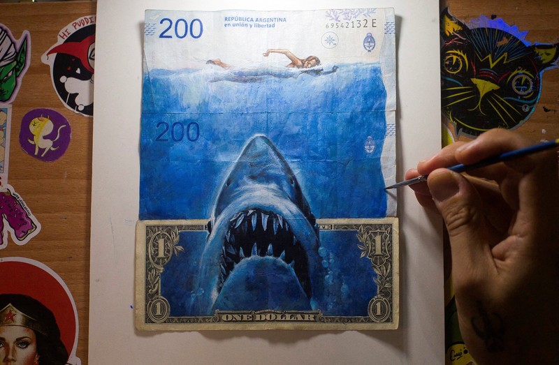 ARGENTINA-ART/INFLATION Artist Sergio Diaz intervenes Argentine pesos bills with characters of the movie