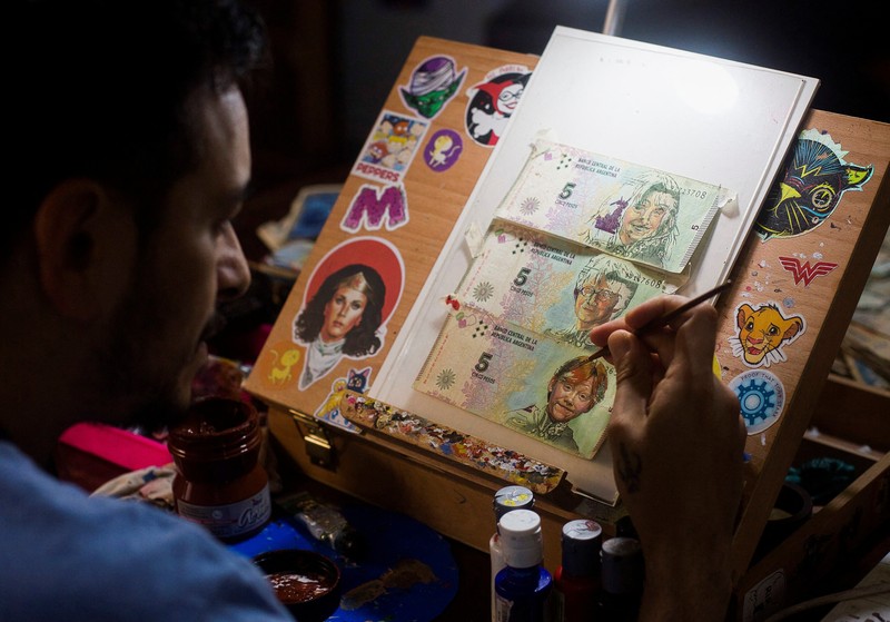 ARGENTINA-ART/INFLATION Artist Sergio Diaz intervenes Argentine pesos bills with characters of the movie