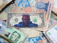 An intervened US dollar bill by artist Sergio Diaz depicting Star War's Darth Maul is pictured over old Argentine pesos bills, in Salta, Argentina, December 30, 2022. REUTERS/Javier Corbalan NO RESALES. NO ARCHIVES