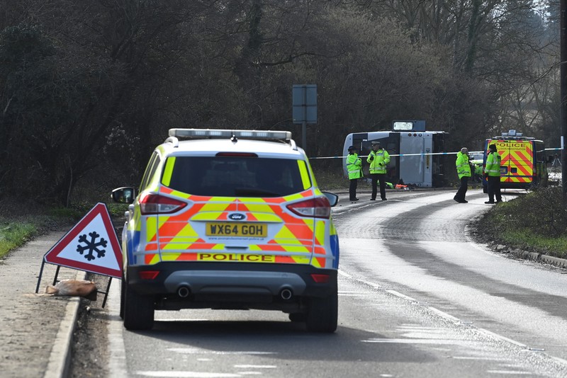 1457084233 CANNINGTON, SOMERSET - JANUARY 17: An aerial view of police at the scene after the early-morning crash on January 17, 2023 near Cannington, Somerset, England. The bus was carrying workers at Hinkley Point C, the nuclear power station about 8 miles from the scene of the crash. (Photo by Finnbarr Webster/Getty Images)