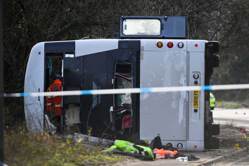 1457084233 CANNINGTON, SOMERSET - JANUARY 17: An aerial view of police at the scene after the early-morning crash on January 17, 2023 near Cannington, Somerset, England. The bus was carrying workers at Hinkley Point C, the nuclear power station about 8 miles from the scene of the crash. (Photo by Finnbarr Webster/Getty Images)
