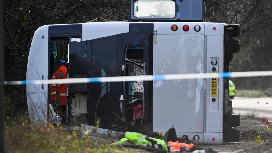 CANNINGTON, SOMERSET - JANUARY 17: An aerial view of police at the scene after the early-morning crash on January 17, 2023 near Cannington, Somerset, England. The bus was carrying workers at Hinkley Point C, the nuclear power station about 8 miles from the scene of the crash. (Photo by Finnbarr Webster/Getty Images)