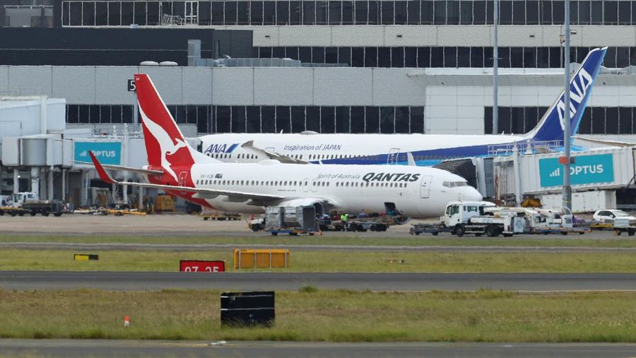 SYDNEY, AUSTRALIA - JANUARY 18: Qantas flight QF144 berths at a gate at Sydney Airport on January 18, 2023 in Sydney, Australia. Emergency services were on standby at Sydney Airport after Qantas flight QF144 from Auckland issued a mayday call on Wednesday afternoon. (Photo by Brendon Thorne/Getty Images)