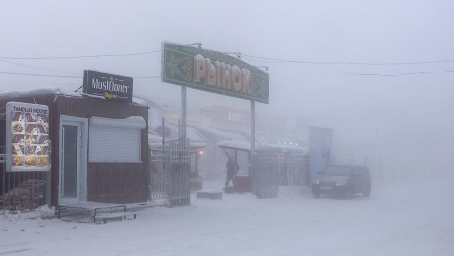 A car drives along a road on a frosty day in Yakutsk, Russia, January 15, 2023. Yakutsk, one of the Russia's north-most cities, is hit by an extreme cold snap as the air temperature on Sunday (January 15) plunged as low as minus 51 degrees Celsius (minus 59.8 degrees Fahrenheit). REUTERS/Roman Kutukov