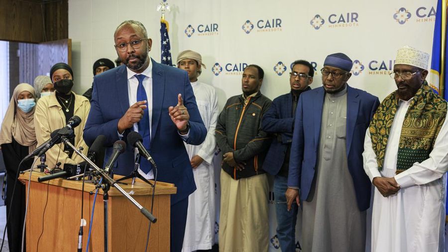 Jaylani Hussein, executive director of the Minnesota chapter of the Council on American-Islamic Relations, speaks during a news conference at CAIR-MN office, Wednesday, Jan. 11, 2023, in Minneapolis. A Hamline University lecturer showed a painting of the Prophet Muhammad and Aram Wedatalla, left, a Hamline University senior and the president of Muslim Student Association (MSA), was one of the students in the class when the image was displayed. (Kerem Yücel/Minnesota Public Radio via AP)