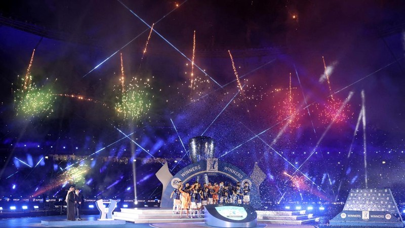 Fireworks explode before the Italian Super Cup final soccer match between AC Milan and Inter Milan at the King Saud University Stadium, in Riyadh, Saudi Arabia, Wednesday, Jan. 18, 2023. (AP Photo/Hussein Malla)