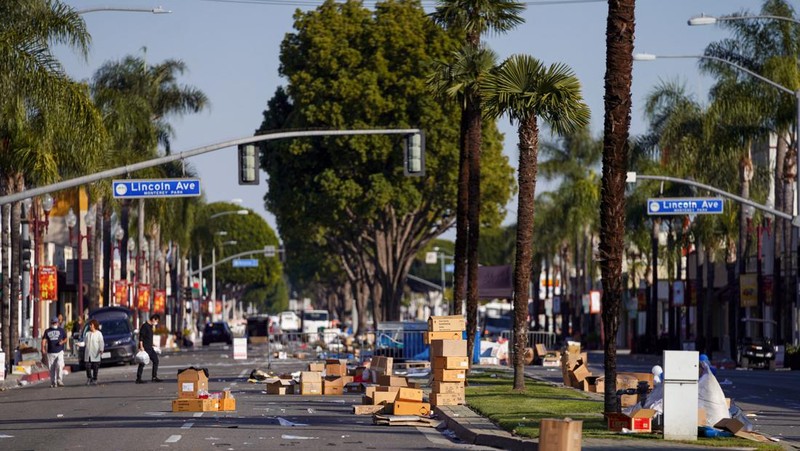 Boxes and trash are left as a Chinese Lunar New Year celebration is taken down near the scene of a shooting that took place during a Chinese Lunar New Year celebration, in Monterey Park, California, U.S. January 22, 2023.  REUTERS/Allison Dinner